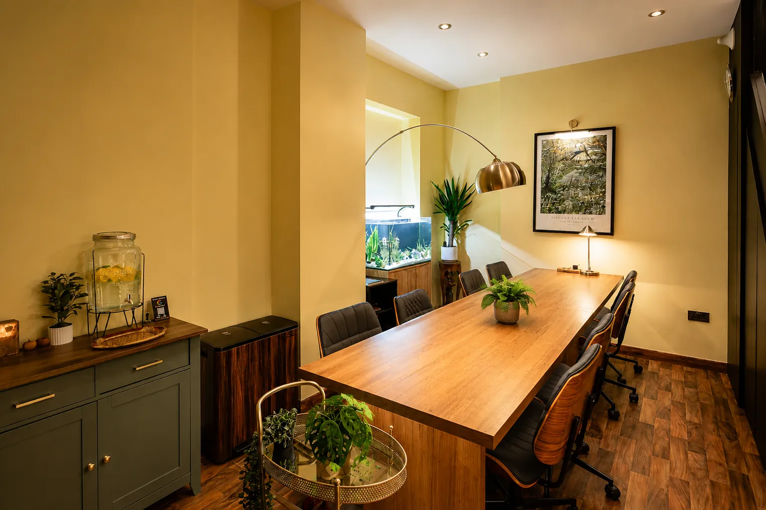 BC Atelier Notting Hill creative workspace from the sideboard — green cabinet, brass cart and planted aquarium